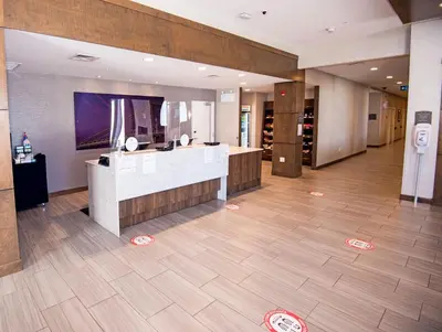 a lobby of a hotel with a counter in a room at Staybridge Suites - Red Deer North by IHG in Red Deer