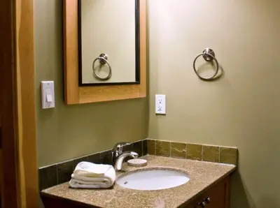 a bathroom with a sink and a mirror at Pinnacle Ridge Chalets by Fernie Lodging Co in Fernie
