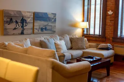 a living room with a couch and two couches at Luxurious 901 Condos by Fernie Central Reservations in Fernie