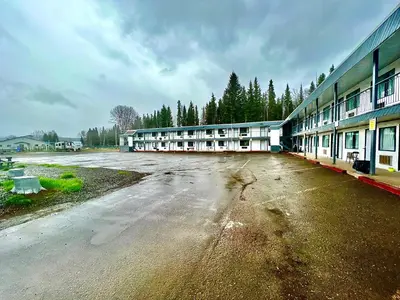 an empty parking lot in front of a building at Houston Motor Inn in Houston