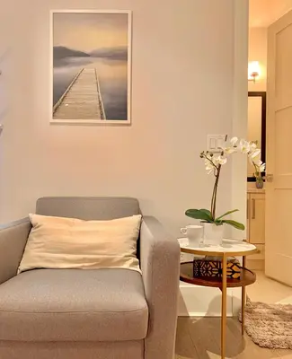 a living room with a couch and a table at Vancouver West Cozy Retreat by Host Launch in Vancouver