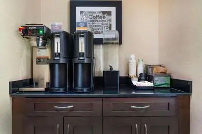 a coffee machine sitting on top of a counter at Best Western Pacific Inn in Vernon