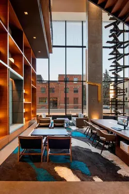 a lobby with tables and chairs and a large window at Residence Inn by Marriott Calgary Downtown/Beltline District in Calgary