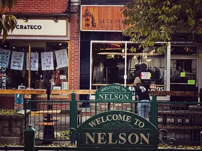 a sign that says welcome to les obsession in front of a building at Morning Star Cabin in Nelson