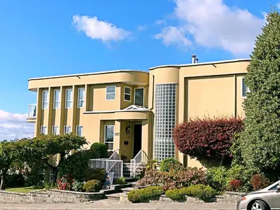 a house with a car parked in front of it at Star of the Sea guest house in White Rock