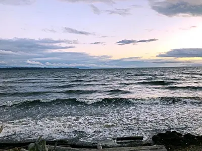 a view of the ocean at sunset at Star of the Sea guest house in White Rock
