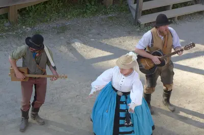 a group of three people playing music at St. George Hotel in Barkerville
