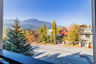a christmas tree is on a street in a town at Lake Placid Lodge by Elevate Vacations in Whistler