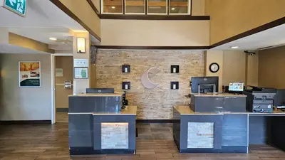 a lobby of a hotel with a check in counter at Comfort Inn in Chilliwack