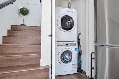 a laundry room with a washer and dryer at Minimal - 90 nights min in Vancouver