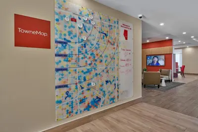 a large wall mural in a lobby with a map at TownePlace Suites by Marriott Edmonton Sherwood Park in Sherwood Park