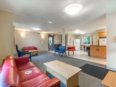 a living room with a couch and a table at Vancouver Island Residences in Nanaimo