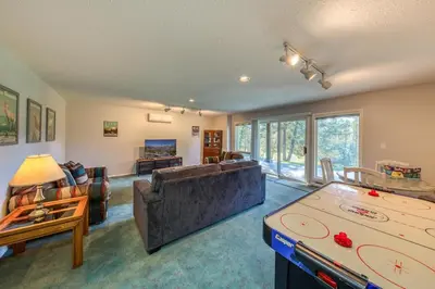 a living room with a ping pong table at Marble Canyon in Fairmont Hot Springs