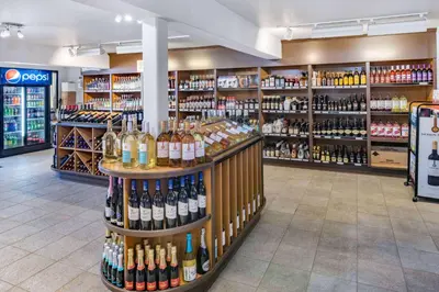 a store filled with lots of bottles of wine at Travelodge by Wyndham Fort St John in Fort Saint John