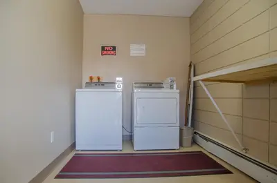 two refrigerators are sitting in a room at Plains Motel in Brooks