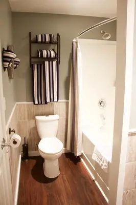 a bathroom with a toilet and a sink at Brown's Bay Resort in Campbell River