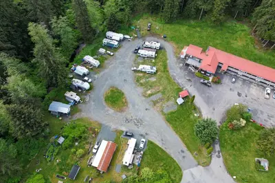 an aerial view of a parking lot with parked vehicles at Pioneer Inn by the River in Port Hardy