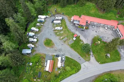 an aerial view of a parking lot with parked vehicles at Pioneer Inn by the River in Port Hardy