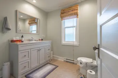a bathroom with a sink and a mirror and a toilet at Outdoor Lovers in Port Alberni