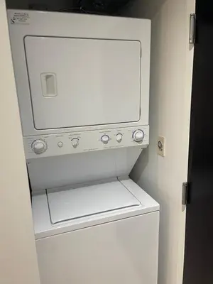 a white washer and dryer in a room at Vancouver Downtown Central 1 bedroom Condo in Vancouver