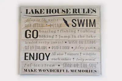 a sign that says lake house rules with a bird on it at Valley View in Lake Cowichan