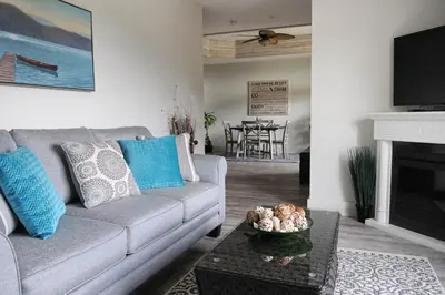 a living room with a couch and a table at Valley View in Lake Cowichan