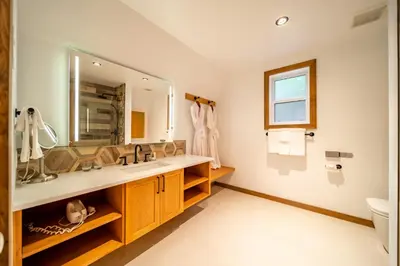 a bathroom with a sink and a mirror at Halcyon Hot Springs Resort in Halcyon Hot Springs