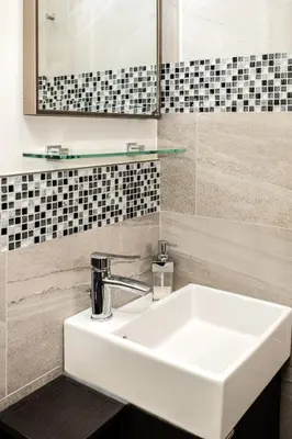 a bathroom with a white sink and a mirror at Crescent Motel in Radium Hot Springs