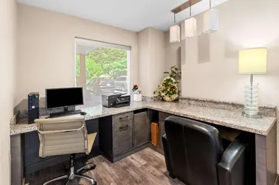 an office with a desk with a computer and a chair at Best Western Cowichan Valley Inn in Duncan