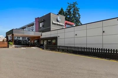 a building with a sign on the side of it at Best Western Cowichan Valley Inn in Duncan