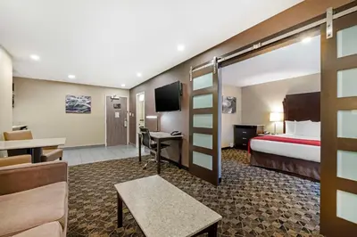 a hotel room with a bed and a desk at Best Western Northgate in Nanaimo