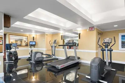 a gym with cardio equipment in a hotel room at Best Western Plus Columbia River Hotel in Trail