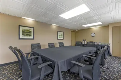 a conference room with a large table and chairs at Best Western Terrace Inn in Terrace