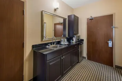 a bathroom with a sink and a mirror at Best Western Sunrise Inn & Suites in Stony Plain