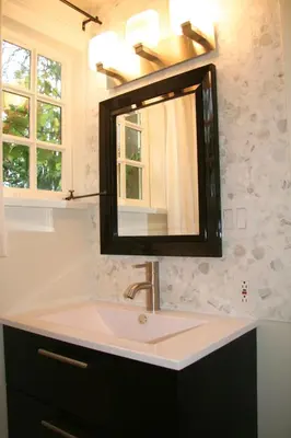 a bathroom with a sink and a mirror at The Craigmyle Inn in Victoria