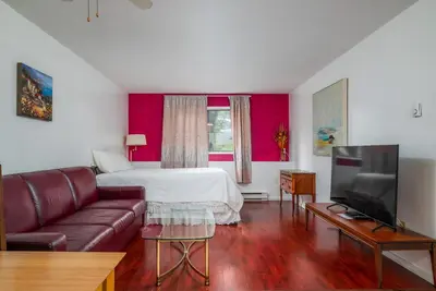 a living room with a bed and a couch at Croft Inn Motel in Crofton