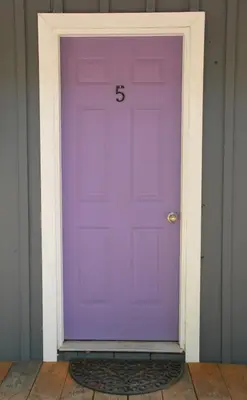 a purple door with the number on it at Jasper Way Inn Resort & Campground in Clearwater
