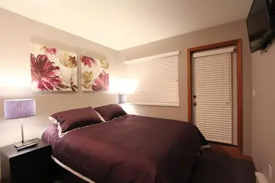 a bedroom with a large bed and a window at Sunpath Condos by Whistler Retreats in Whistler
