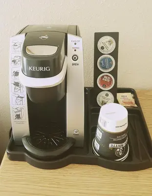 a coffee maker and a cup on a table at Travelodge by Wyndham McBride in McBride