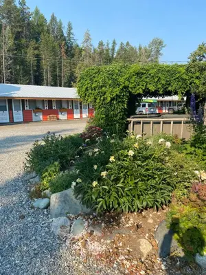 a flower garden in front of a building at North Star Motel in Kimberley