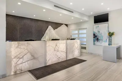 a lobby with a marble counter in a room at Executive Residency by Best Western Calgary City View North in Calgary