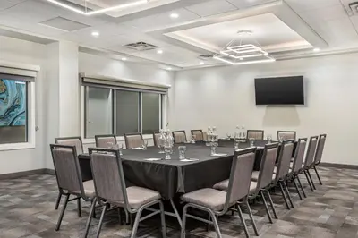 a conference room with a long table and chairs at Executive Residency by Best Western Calgary City View North in Calgary