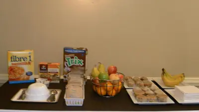 a table with a bunch of food on it at Stampeder Inn in Ponoka
