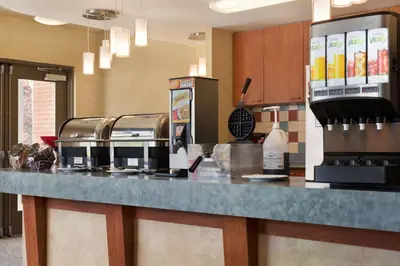 a kitchen with a counter with two toasters on it at Ramada by Wyndham Nanaimo in Nanaimo