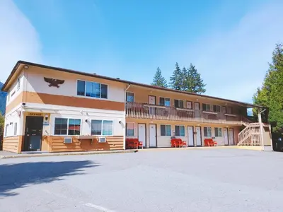 a large building with a balcony on the side of it at Red Roof Motor Inn in Hope