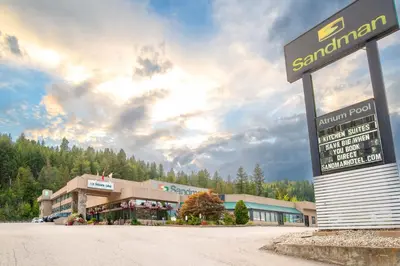 a santander building with a sign in front of it at Sandman Hotel Castlegar in Castlegar
