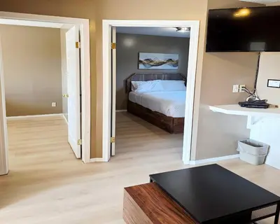 a bedroom with a bed and a large mirror at Skimmerhorn Inn in Creston