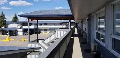 a balcony of a building with a view of a parking lot at Howard Johnson by Wyndham Hinton in Hinton