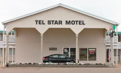 a car parked in front of a tell star motel at Tel Star Motel in Brooks
