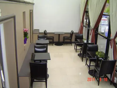 a row of tables and chairs in a waiting room at Barclay Hotel in Vancouver